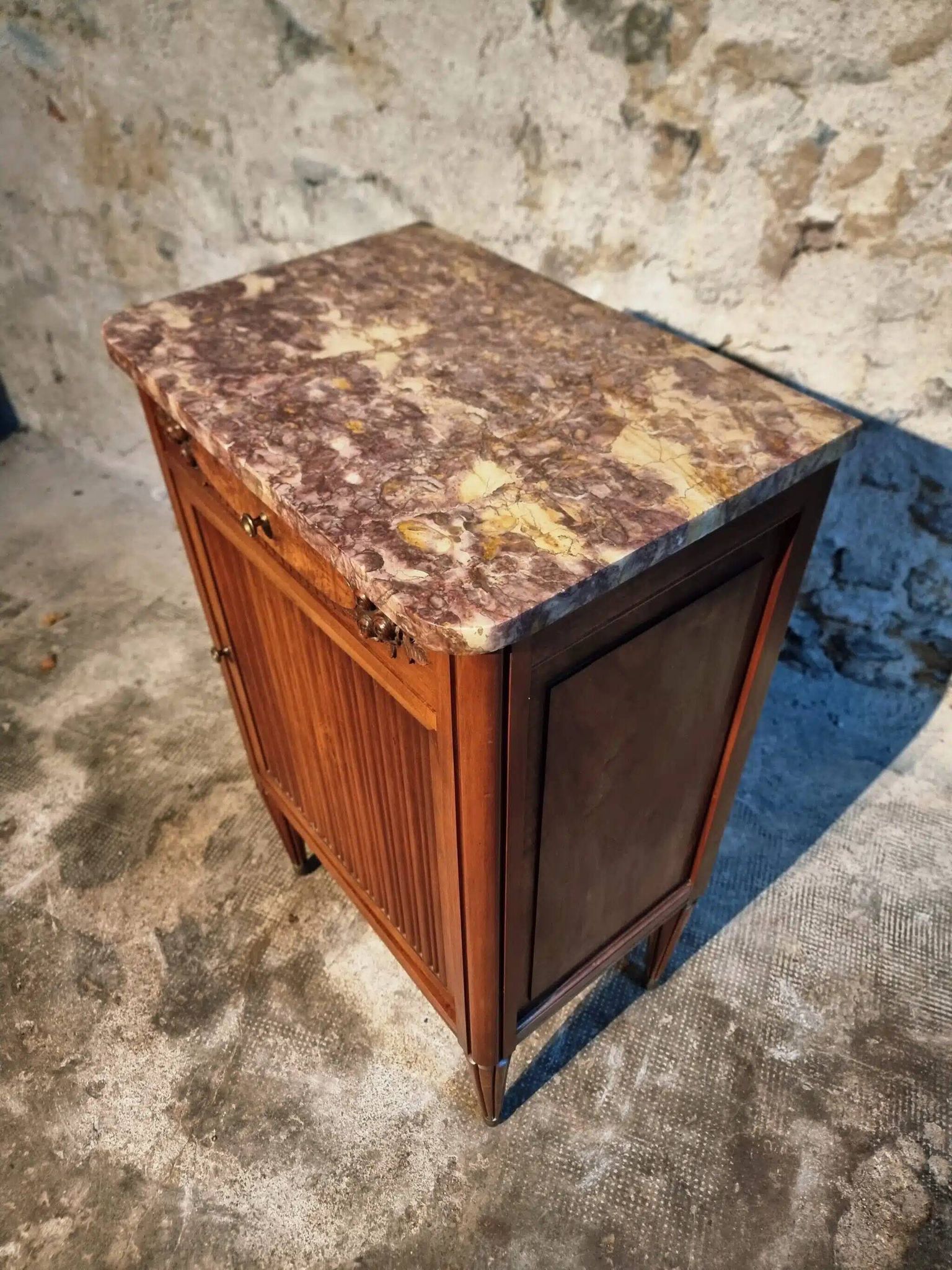 French antique bedside table in walnut with a marble top and porcelain interior, early 20th century.