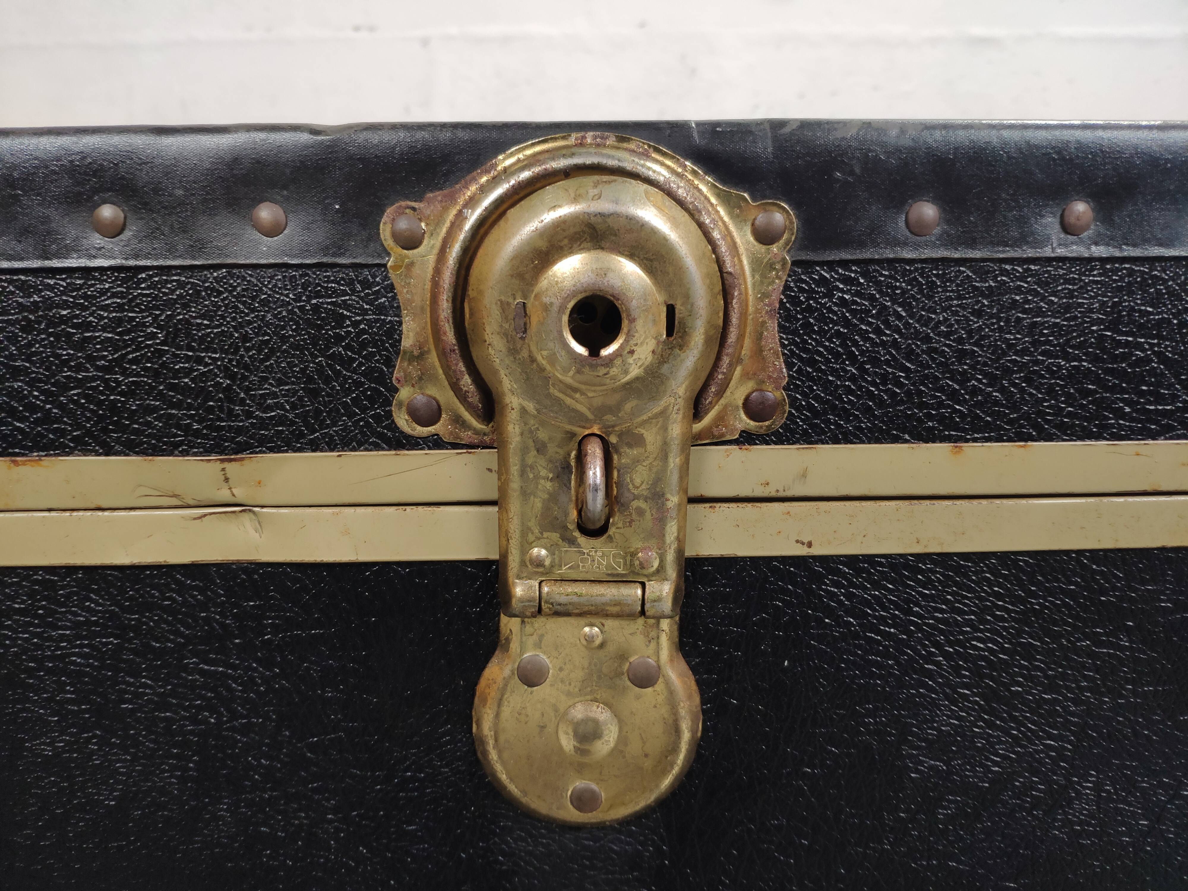 Old black trunk and brass