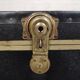 Old black trunk and brass