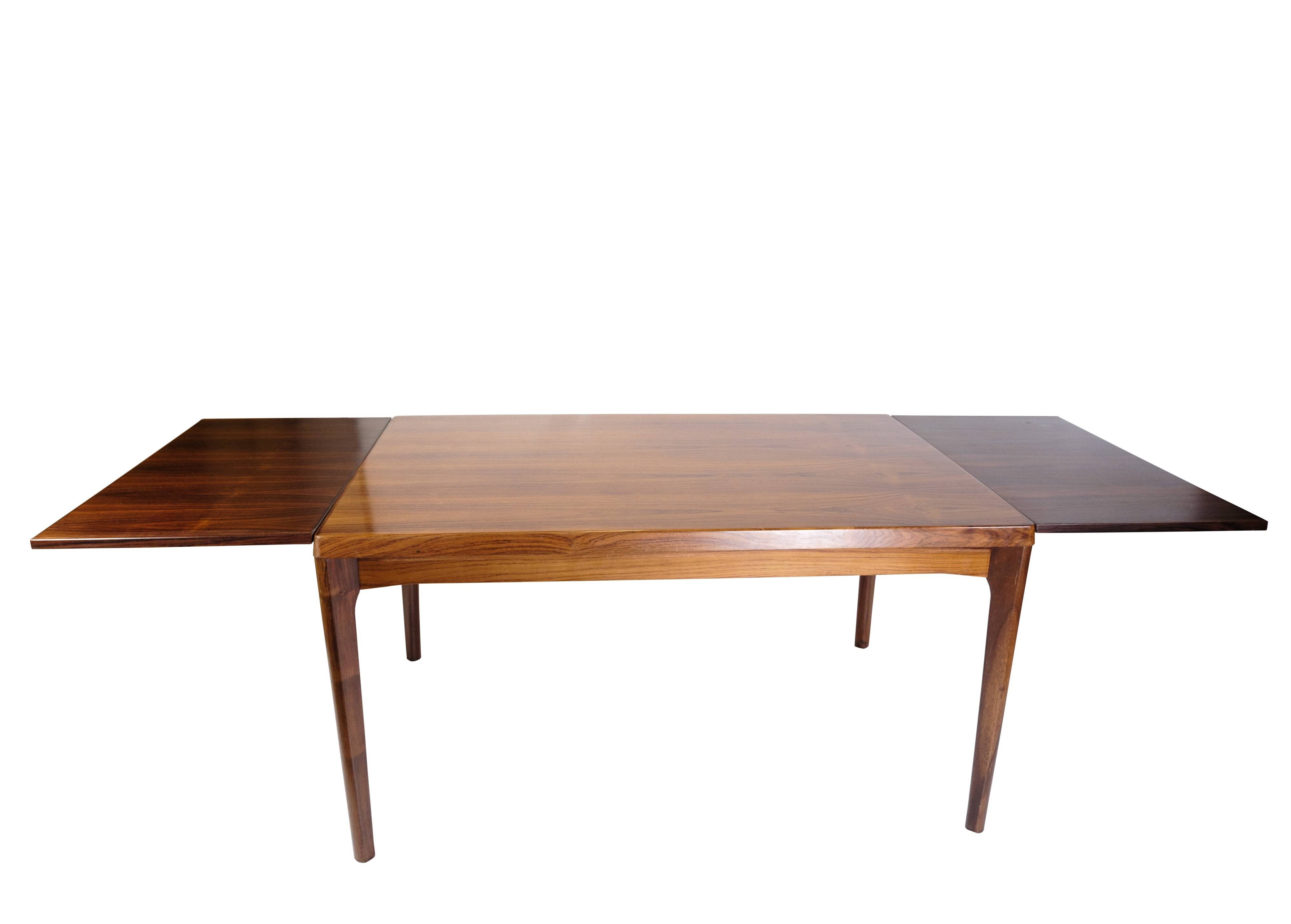 Dining Table With extensions Made In Rosewood By Henning Kjærnulf From 1960s