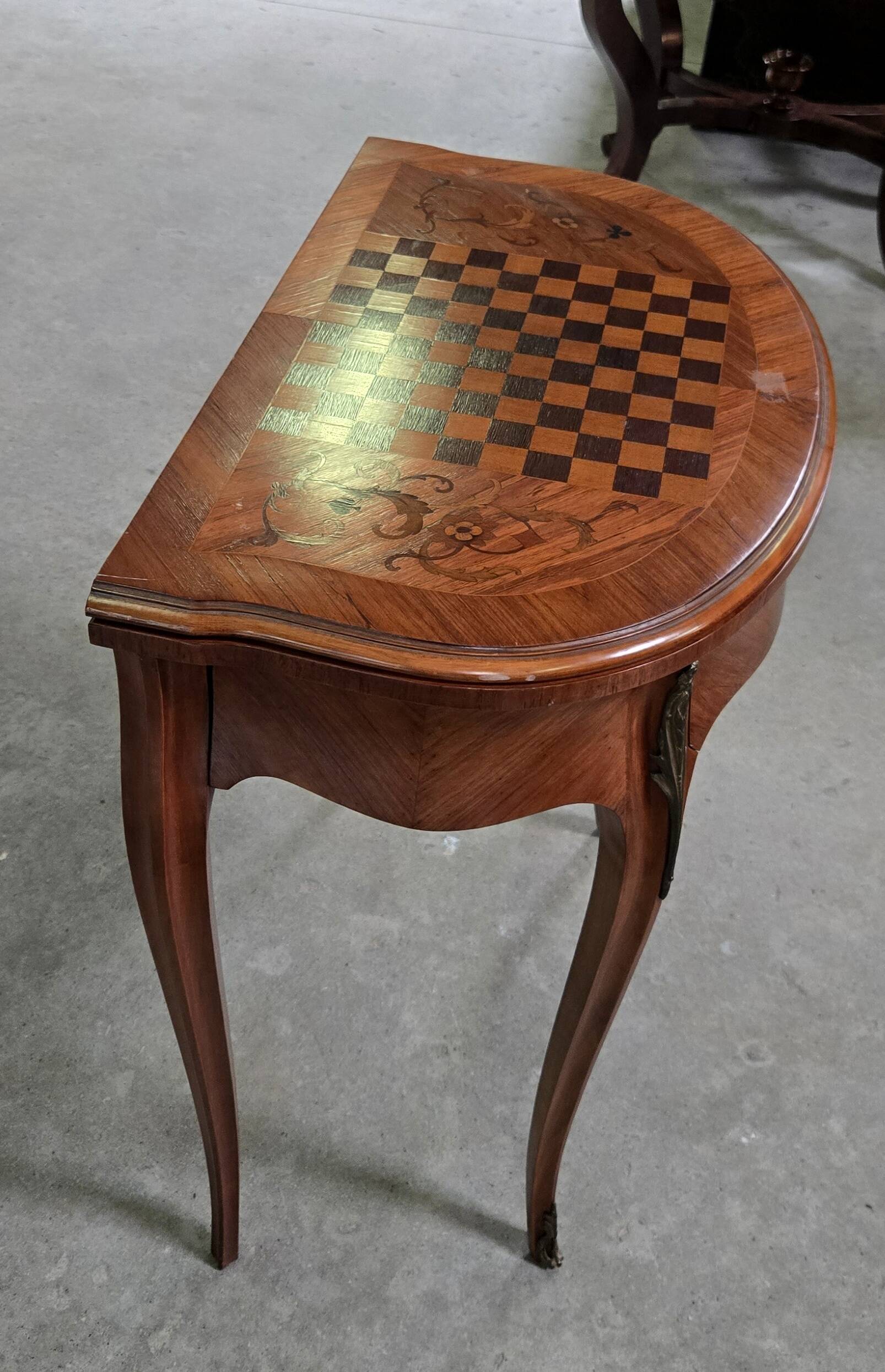 Half-moon gaming table in Louis XV style, made of precious wood marquetry.