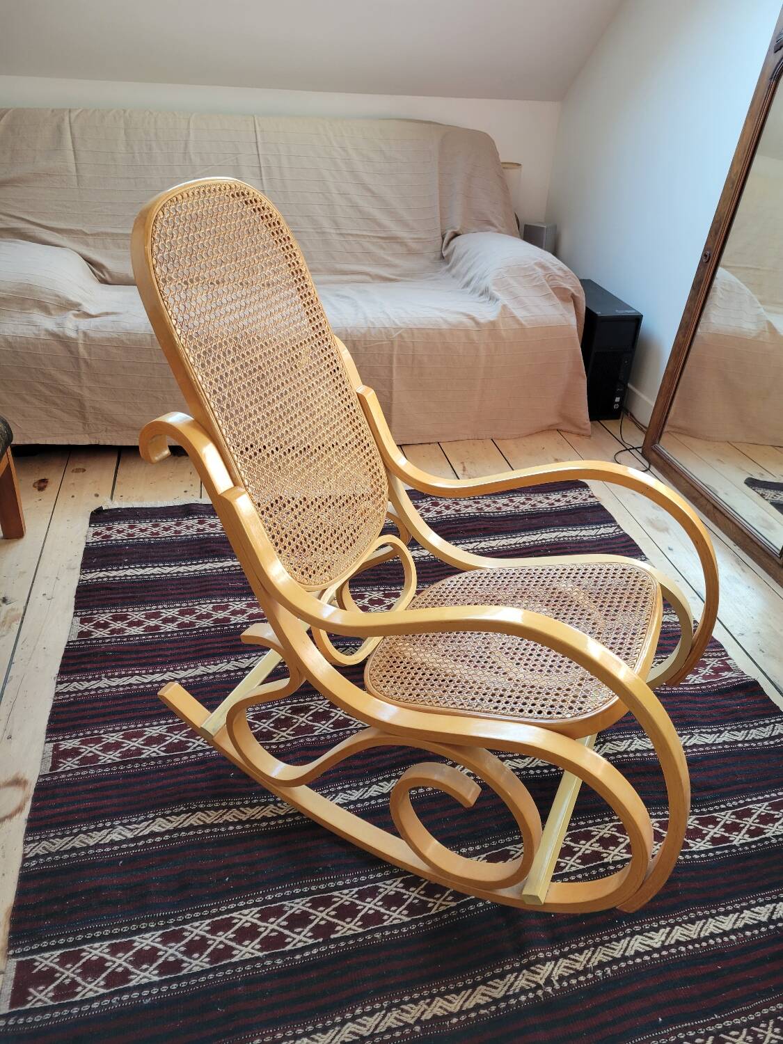 Rocking chair in arched wood and cane