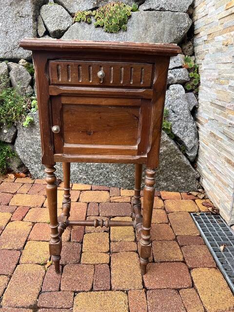 Wooden bedside table with marble top