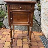 Wooden bedside table with marble top