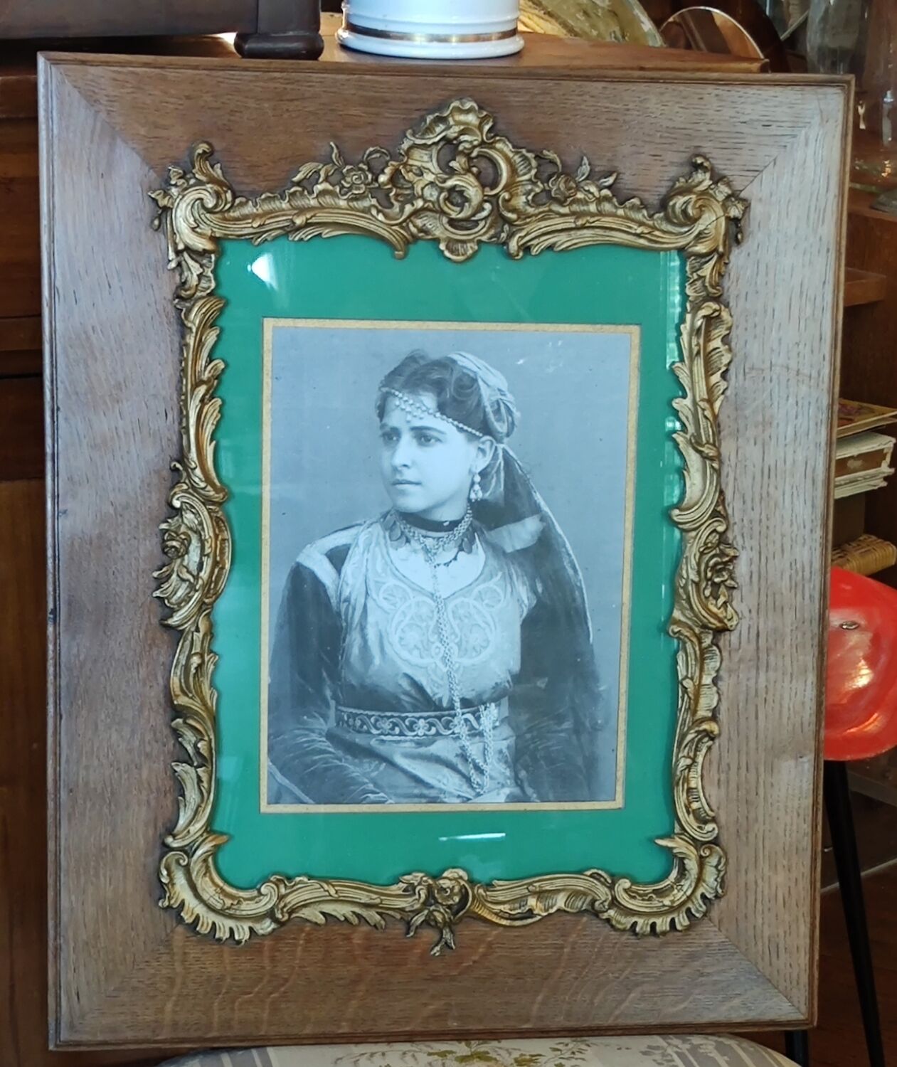 Old wooden frame and bronze ornament