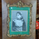 Old wooden frame and bronze ornament