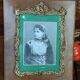 Old wooden frame and bronze ornament
