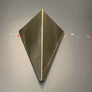Pair of geometric vintage wall lamps in solid brass, France 1970.