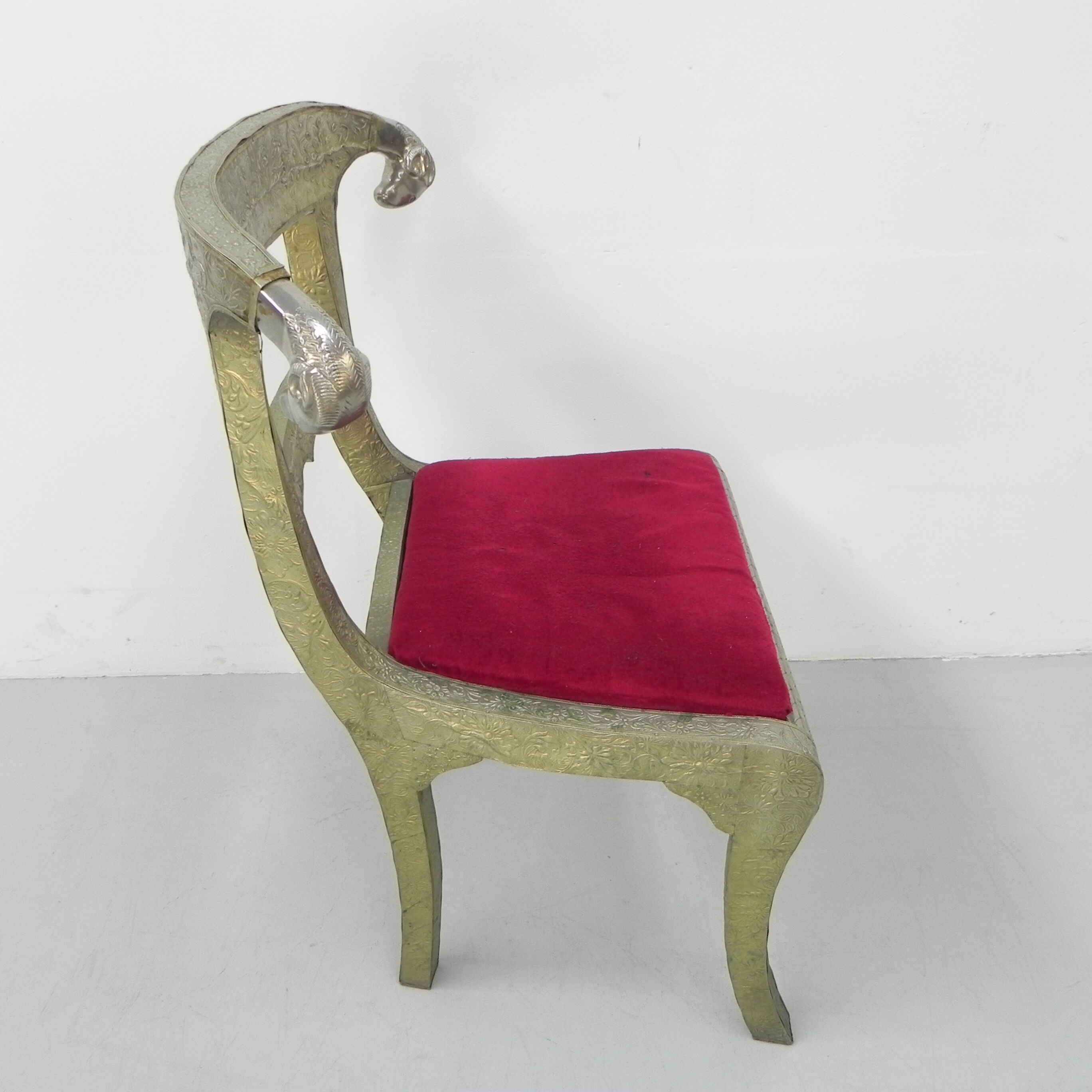 Dining chair upholstered with stamped tin