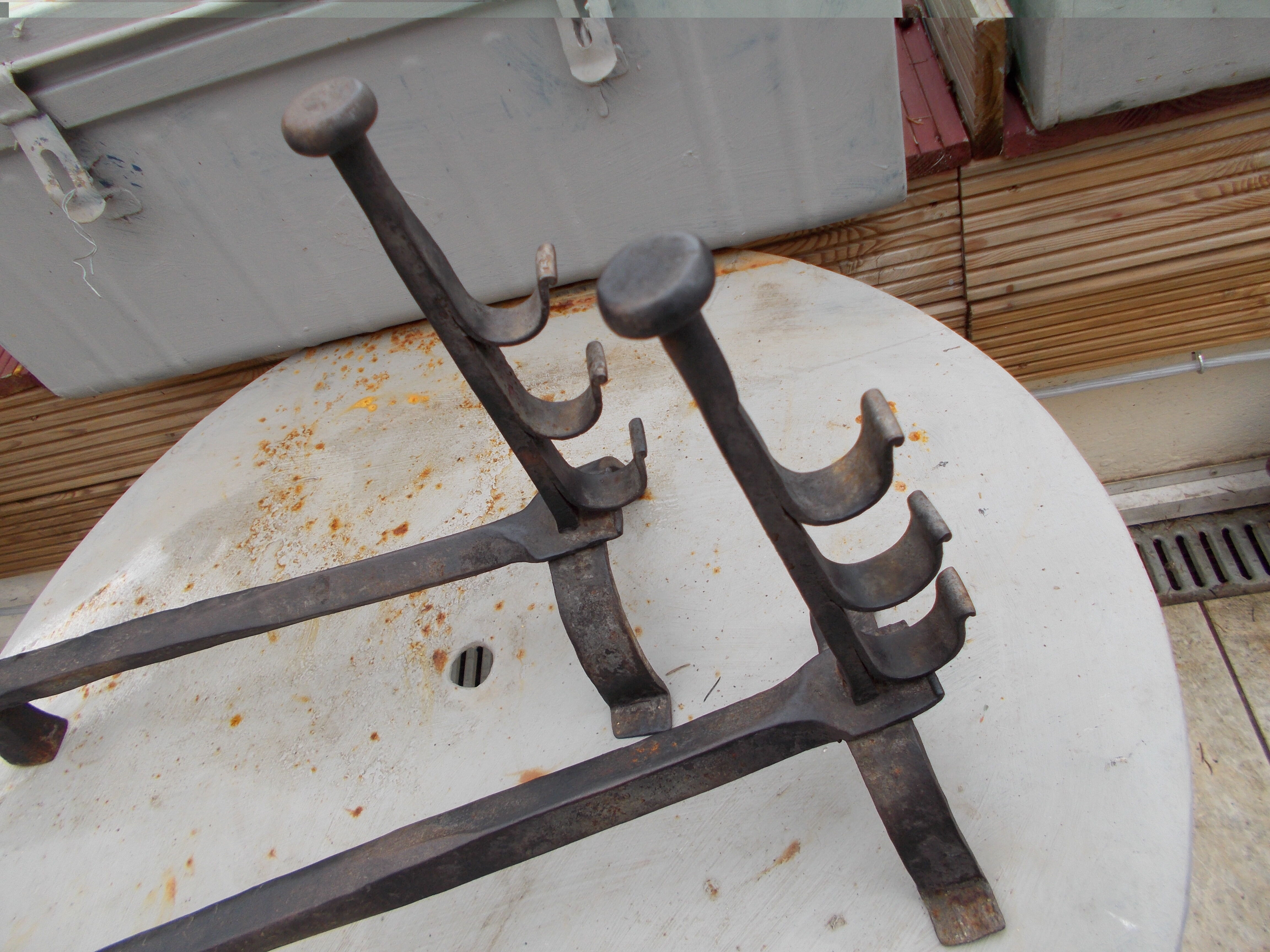 Old pair of wrought iron pegs