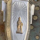 Pair of metal candlesticks, chiseled with a statuette in front, rose pattern in relief, art deco