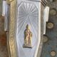 Pair of metal candlesticks, chiseled with a statuette in front, rose pattern in relief, art deco