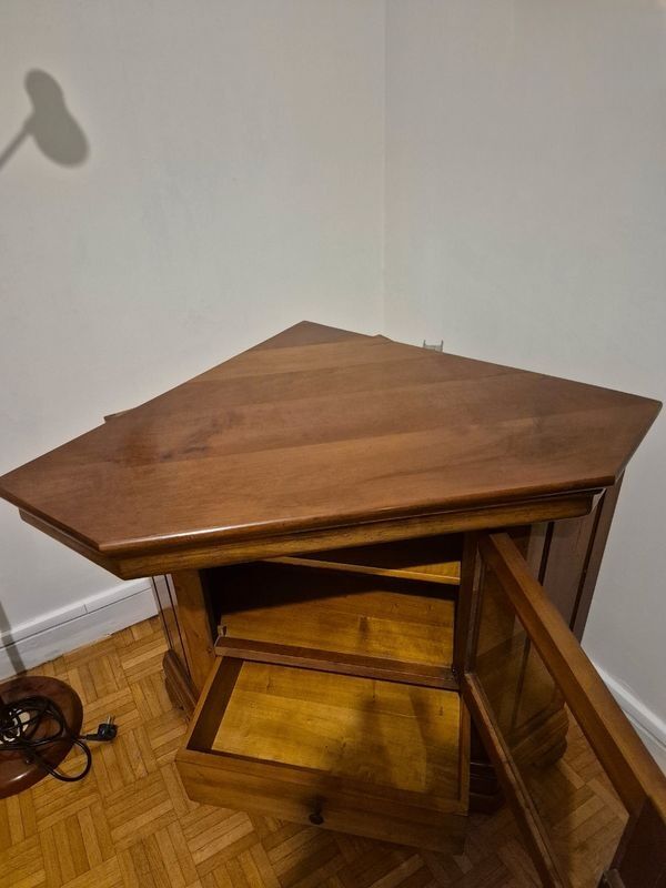 Wooden TV unit with a rotating top.