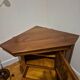 Wooden TV unit with a rotating top.