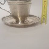 cups and saucers in solid silver