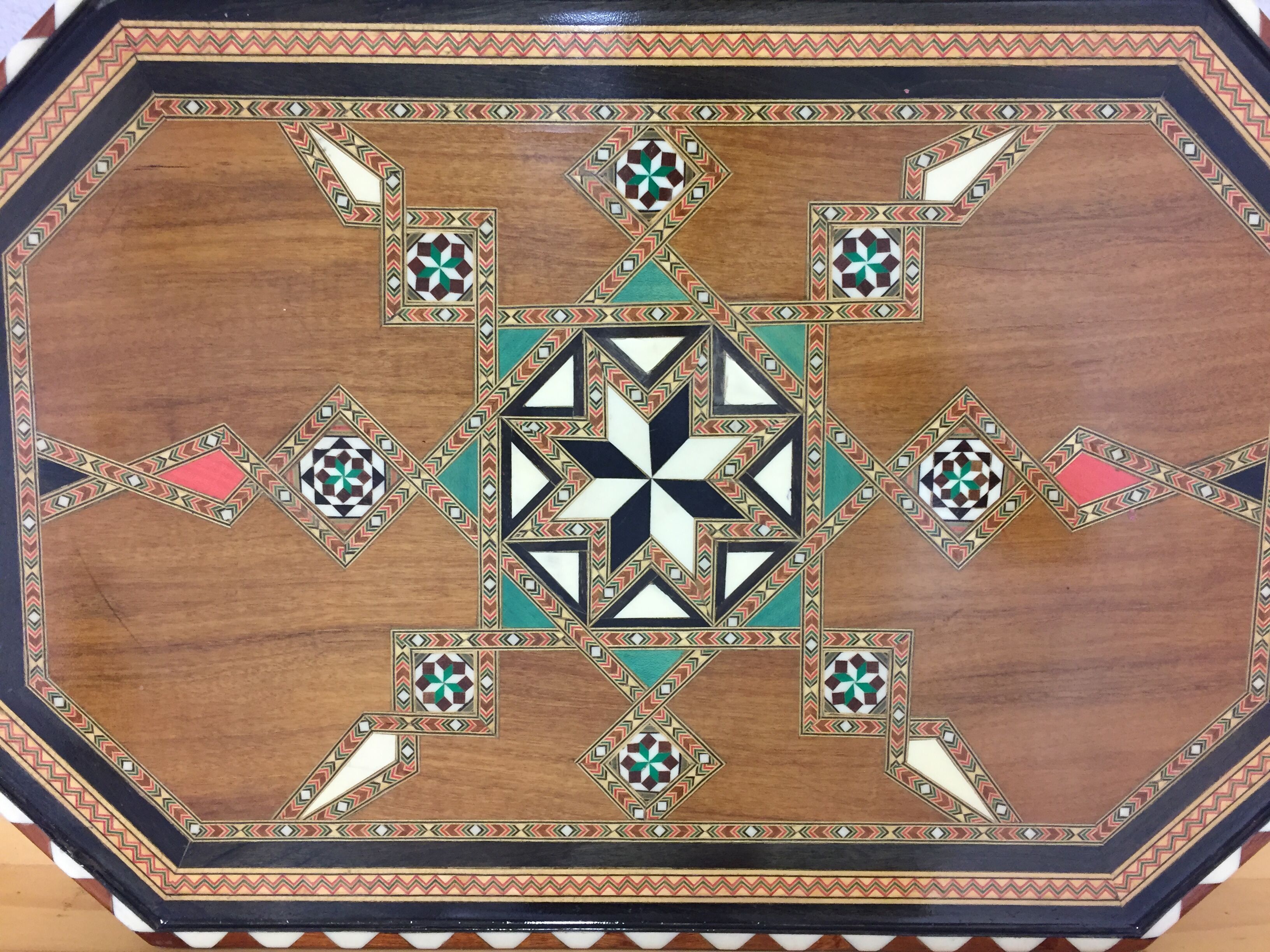 Old geometric marquetry top design'