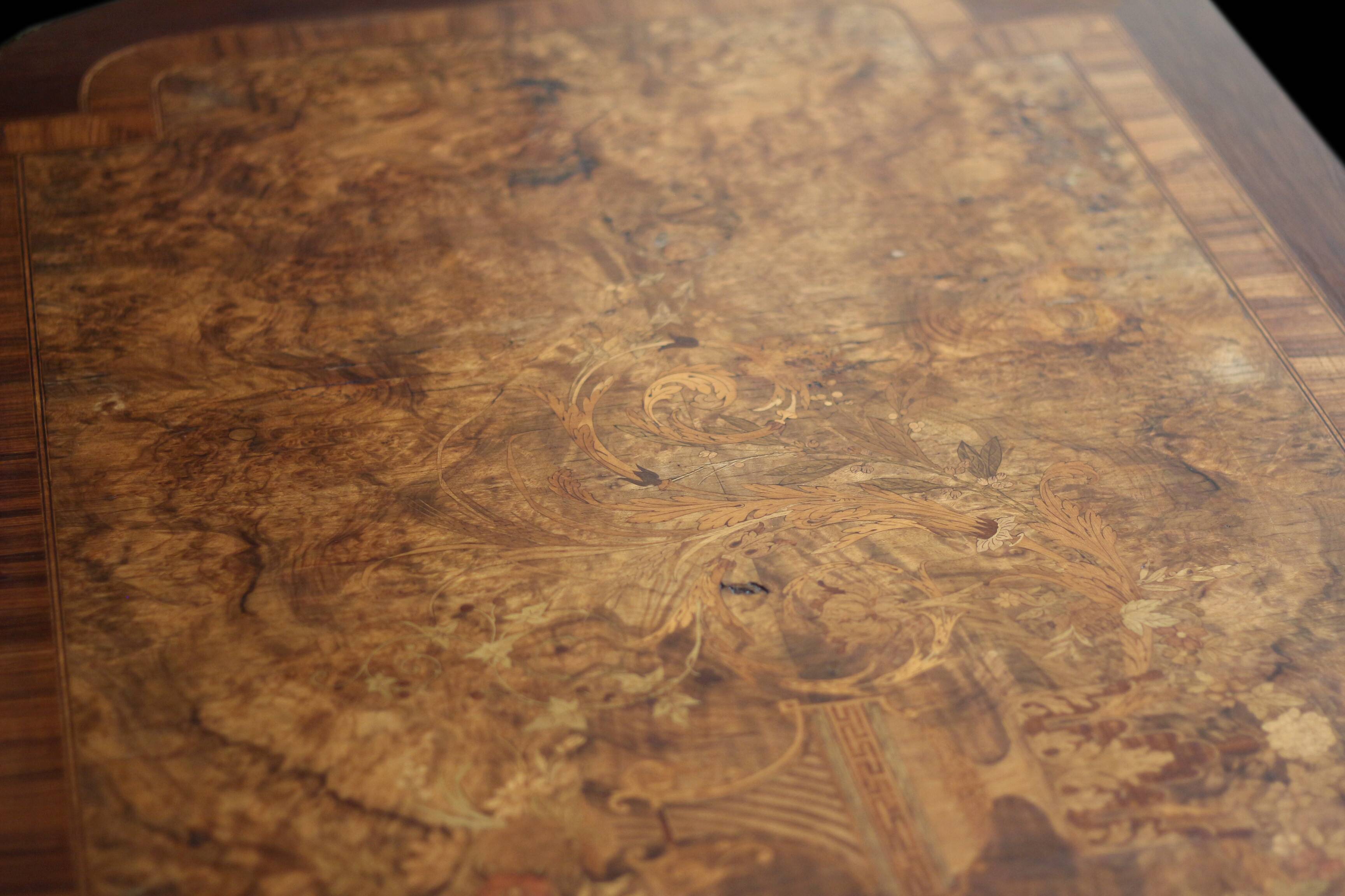 Superb Napoleon III table. Marquetry top and gilded bronzes.