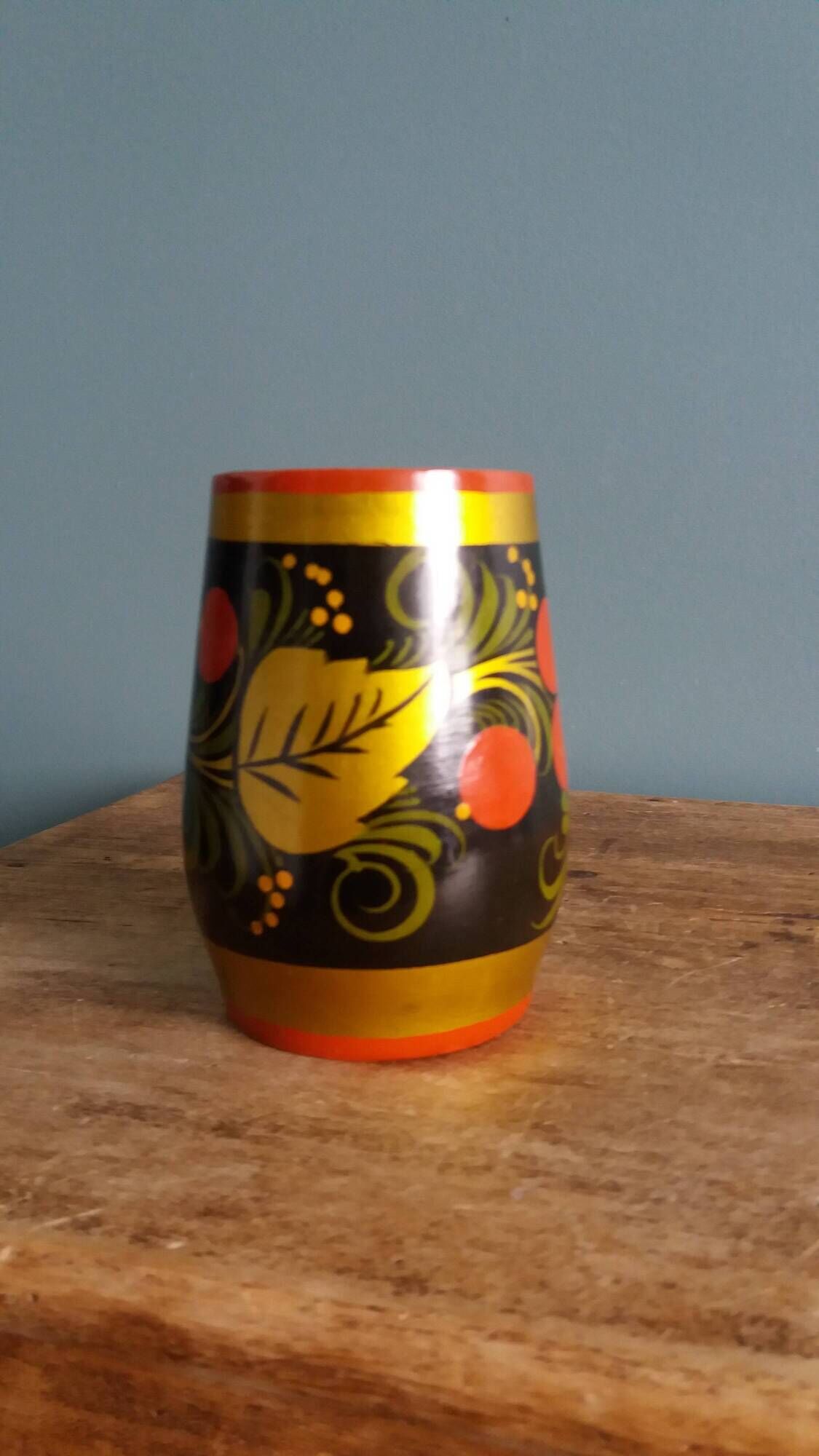 Khokhloma vase, Russian lacquered wood craftsmanship, hand-painted decoration.