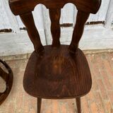 4 wooden chairs with brutalist design