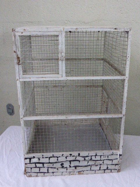 Vintage bird cage, made of wood and chicken wire metal square mesh