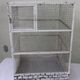 Vintage bird cage, made of wood and chicken wire metal square mesh