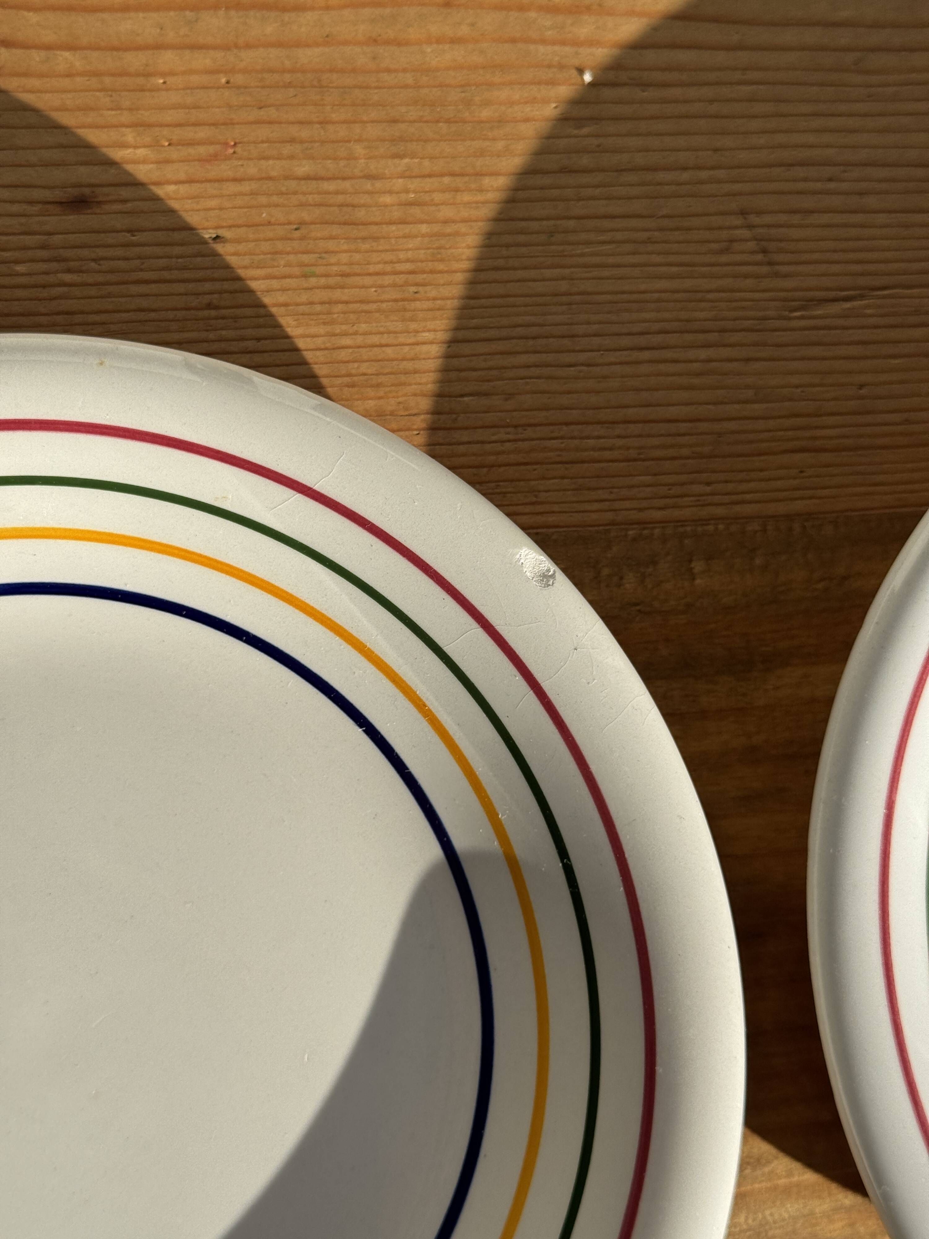 Set of 9 small Italian dessert plates Primula with red and green trim.