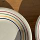Set of 9 small Italian dessert plates Primula with red and green trim.