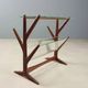 Vintage magazine rack in beech, glass and brass, Italian design from the 1950s.