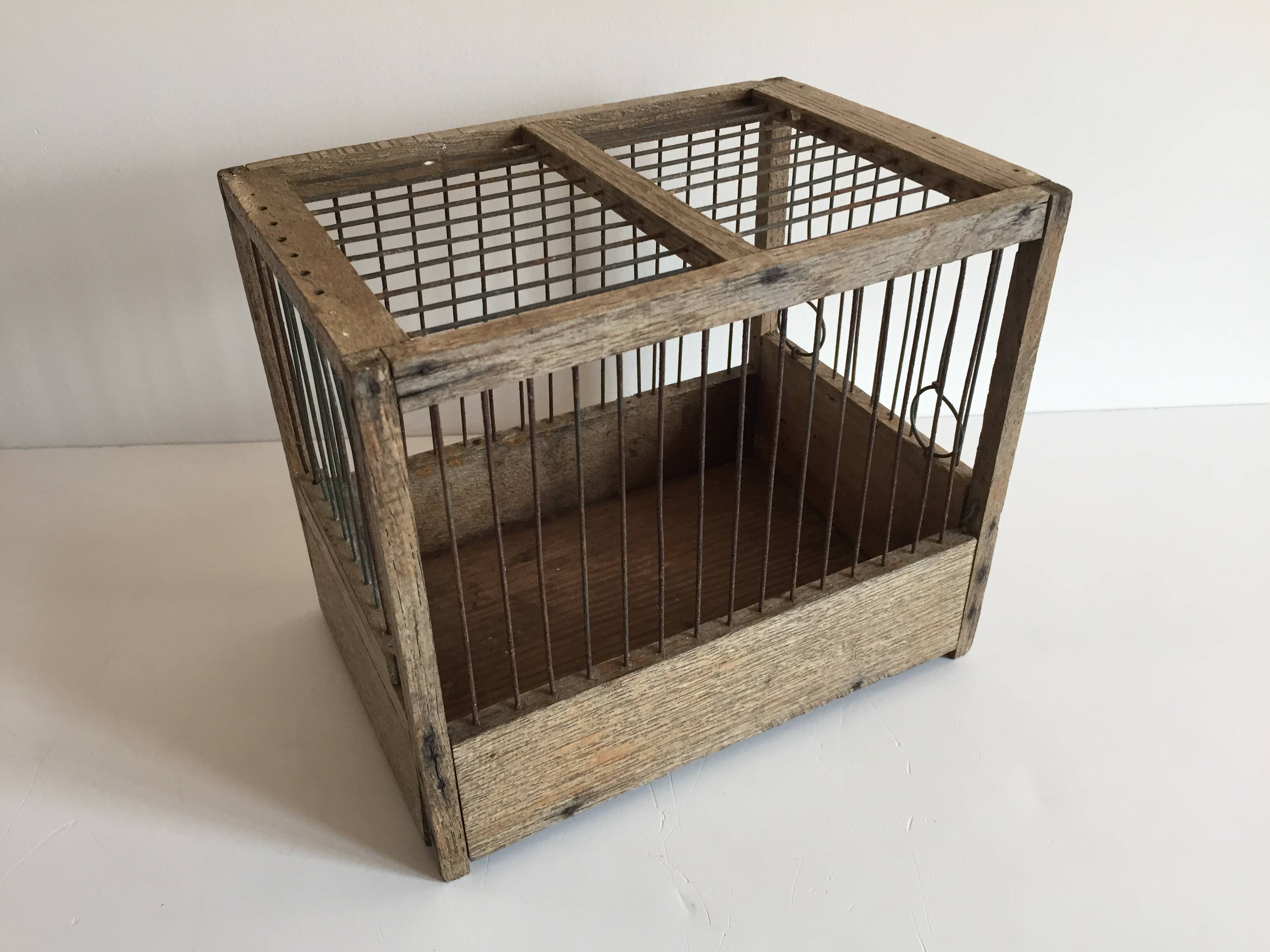 Old bird cage in wood and steel