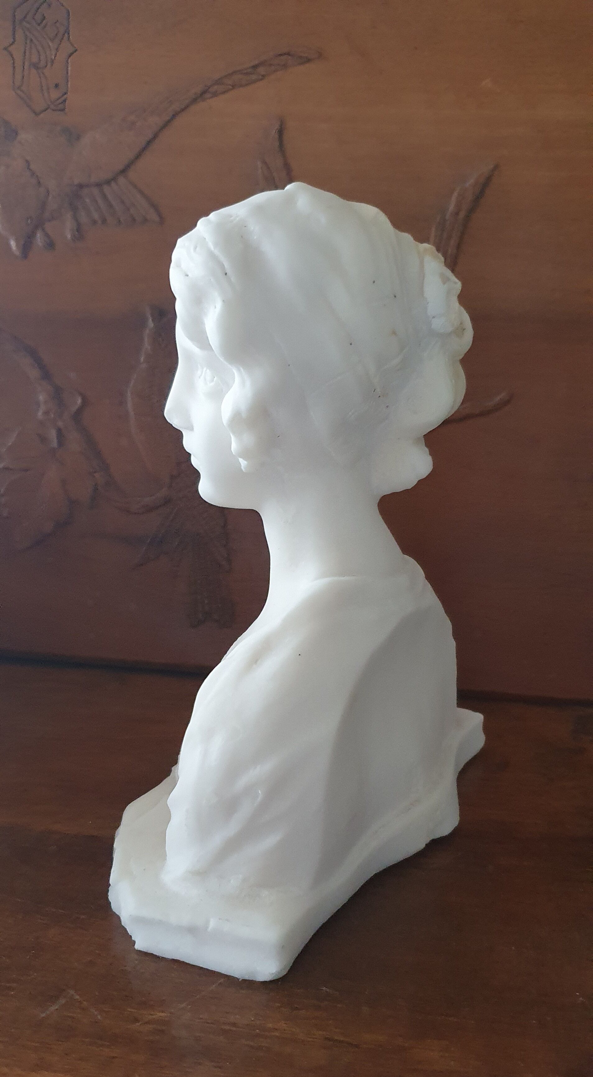 Bust of young woman L.Mignon