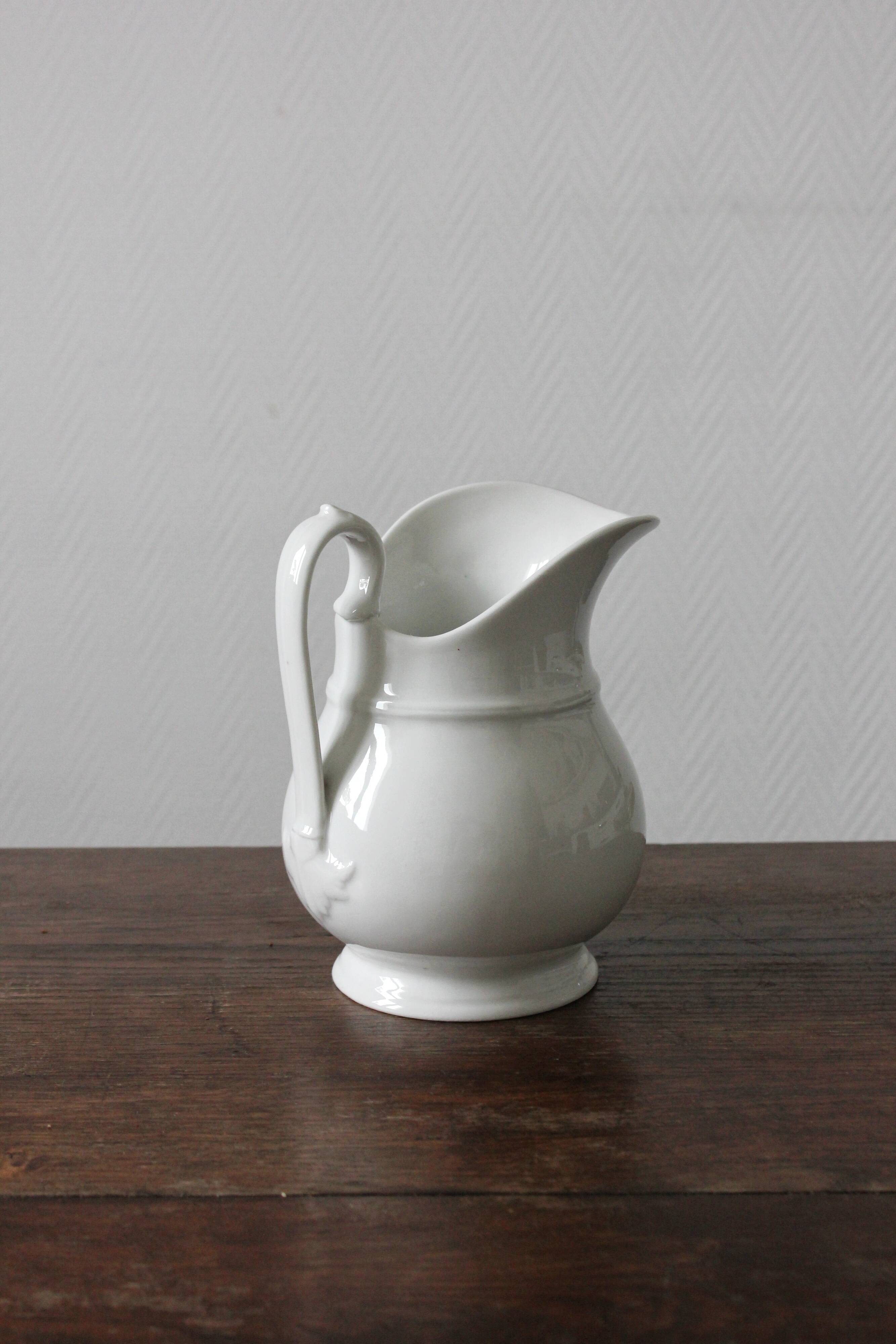 Old broc in white earthenware