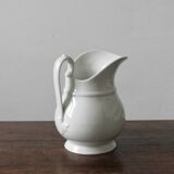 Old broc in white earthenware