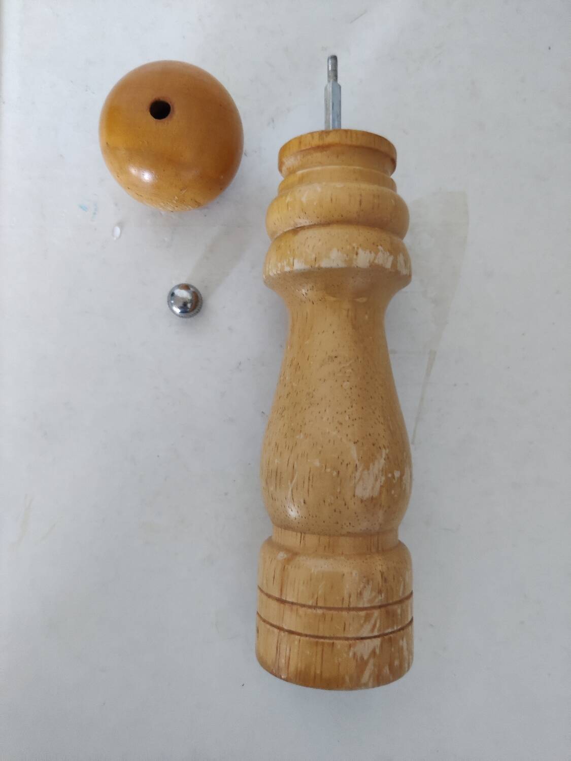 Turned wooden pepper mill