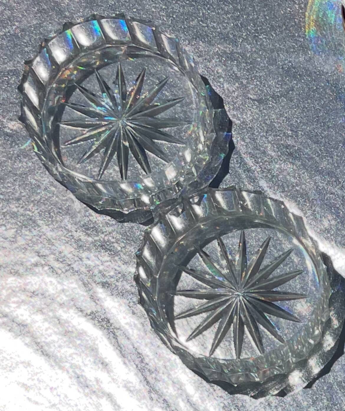 A pair of vintage cut glass catchalls.