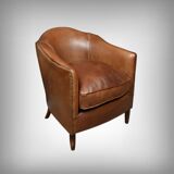 Solange club armchair in sheepskin leather.