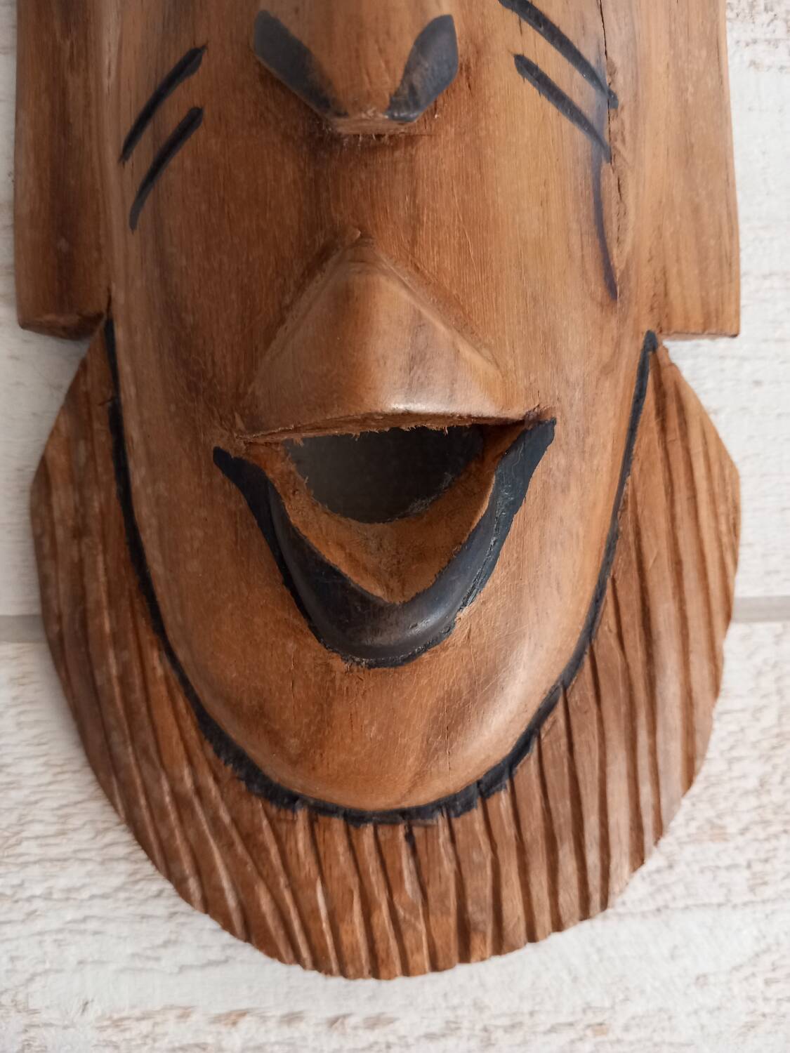 African mask in light wood
