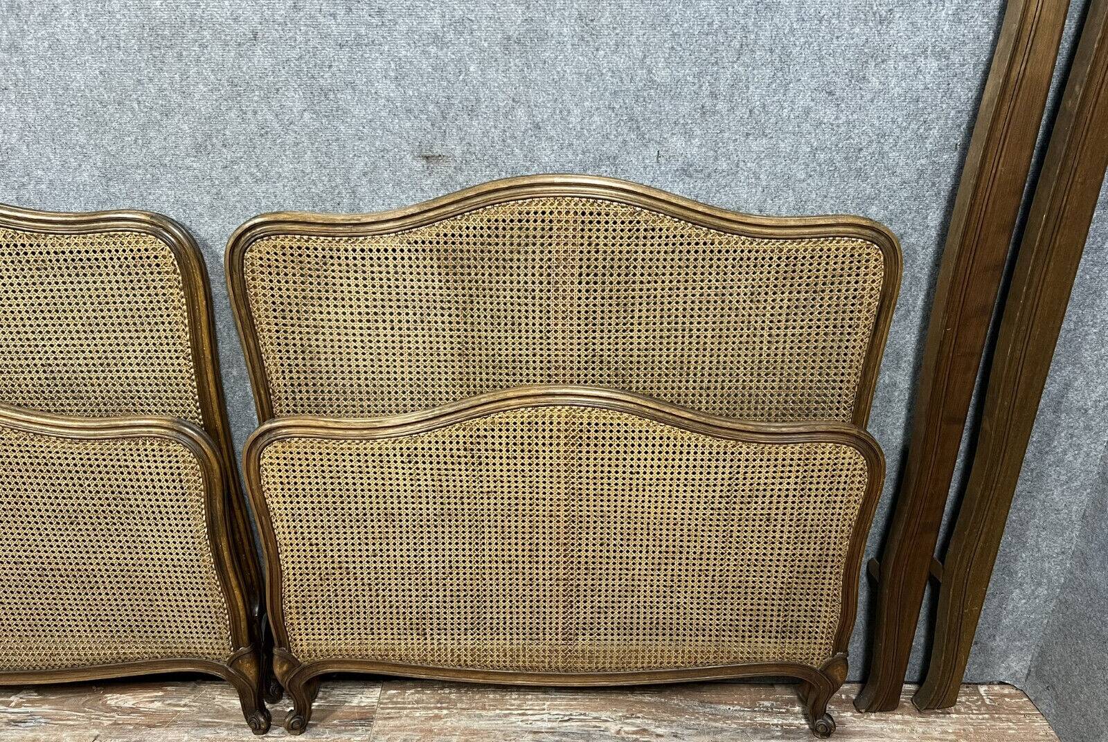 Pair of Louis XV style center beds in walnut and cane base circa 1900