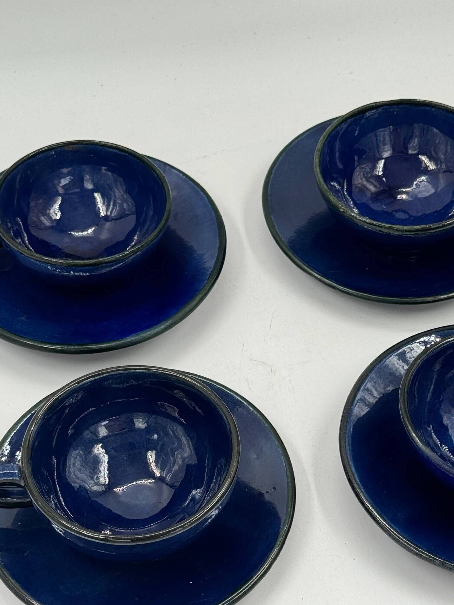 Set of 4 vintage ceramic cups and saucers, cobalt blue glaze.