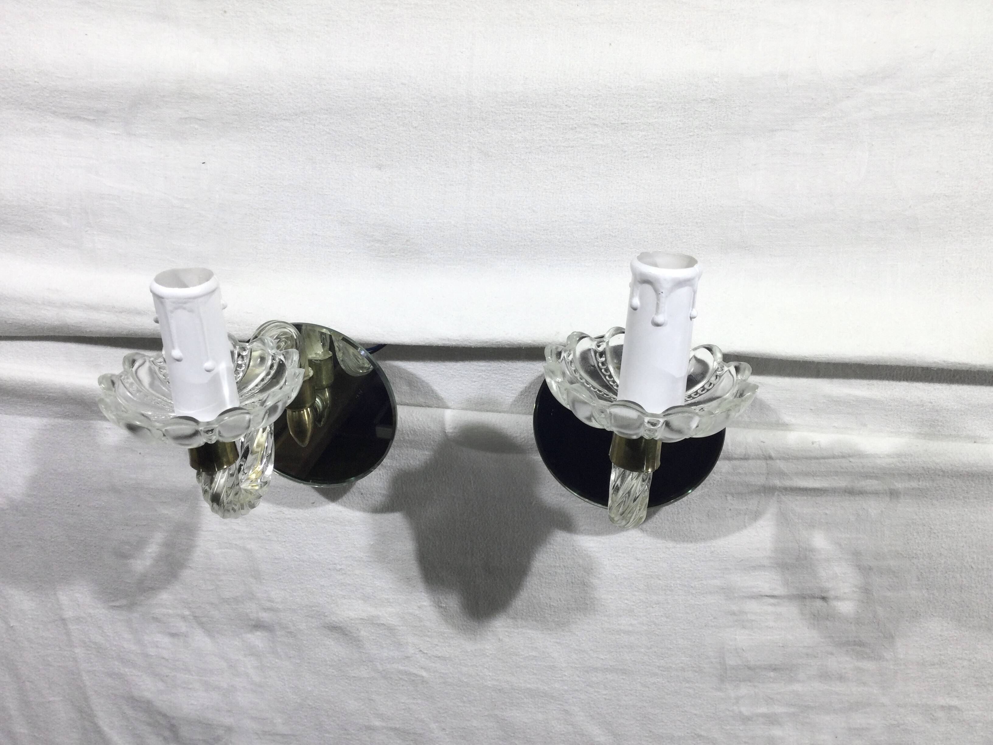 Pair of glass and mirror sconces