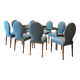 Table ghibli en verre avec 8 chaises parisiennes pieds sabrés roche bobois