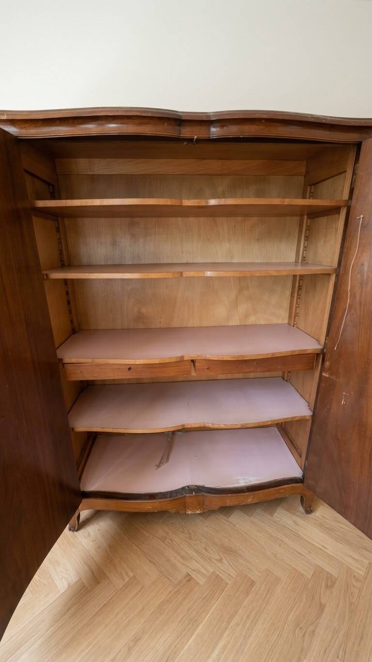 Antique Louis XV wardrobe in wood with chevron pattern.
