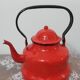Red enamelled tin kettle
