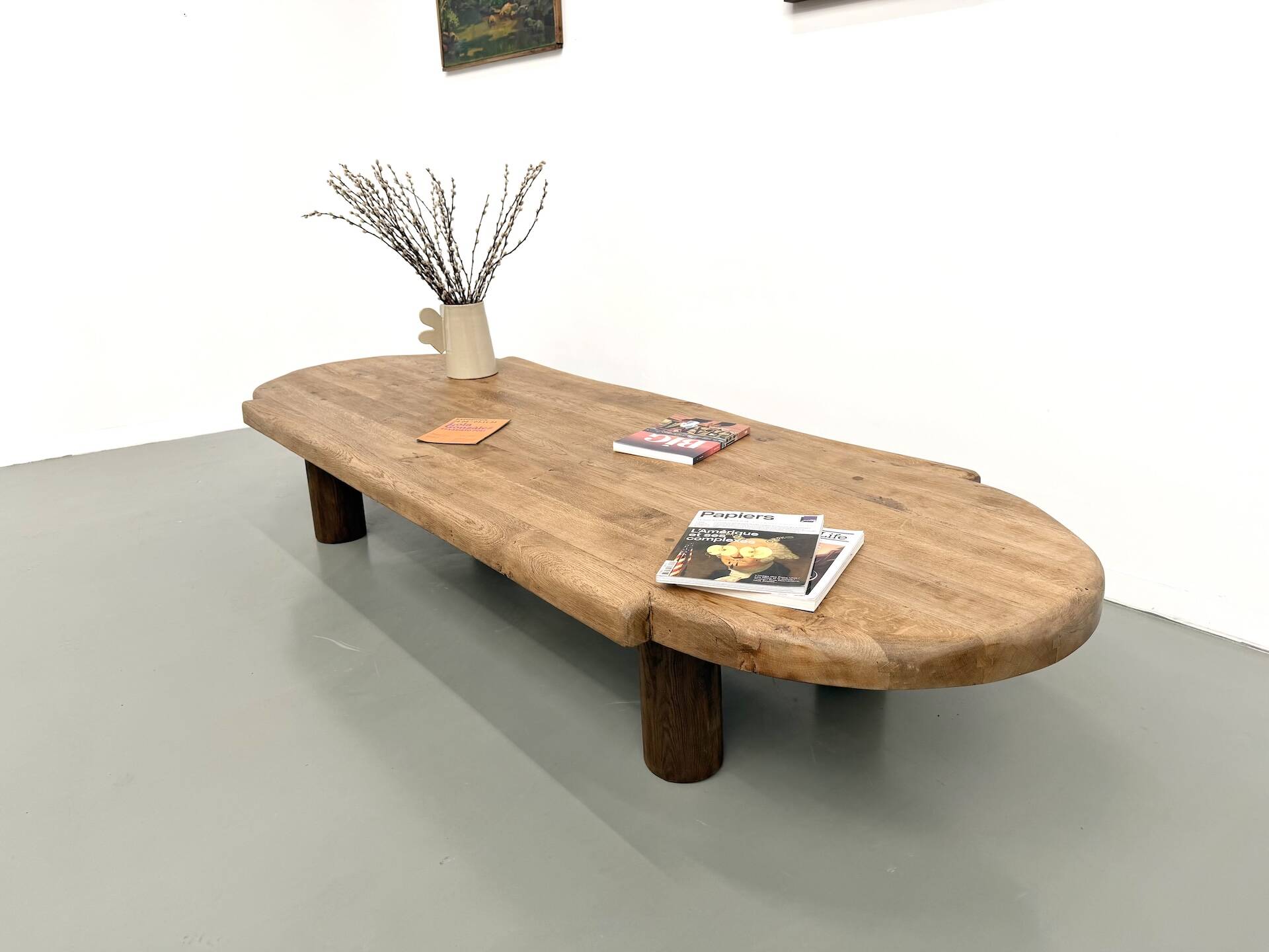XXL oval coffee table in solid oak, cylindrical base, 1950s.
