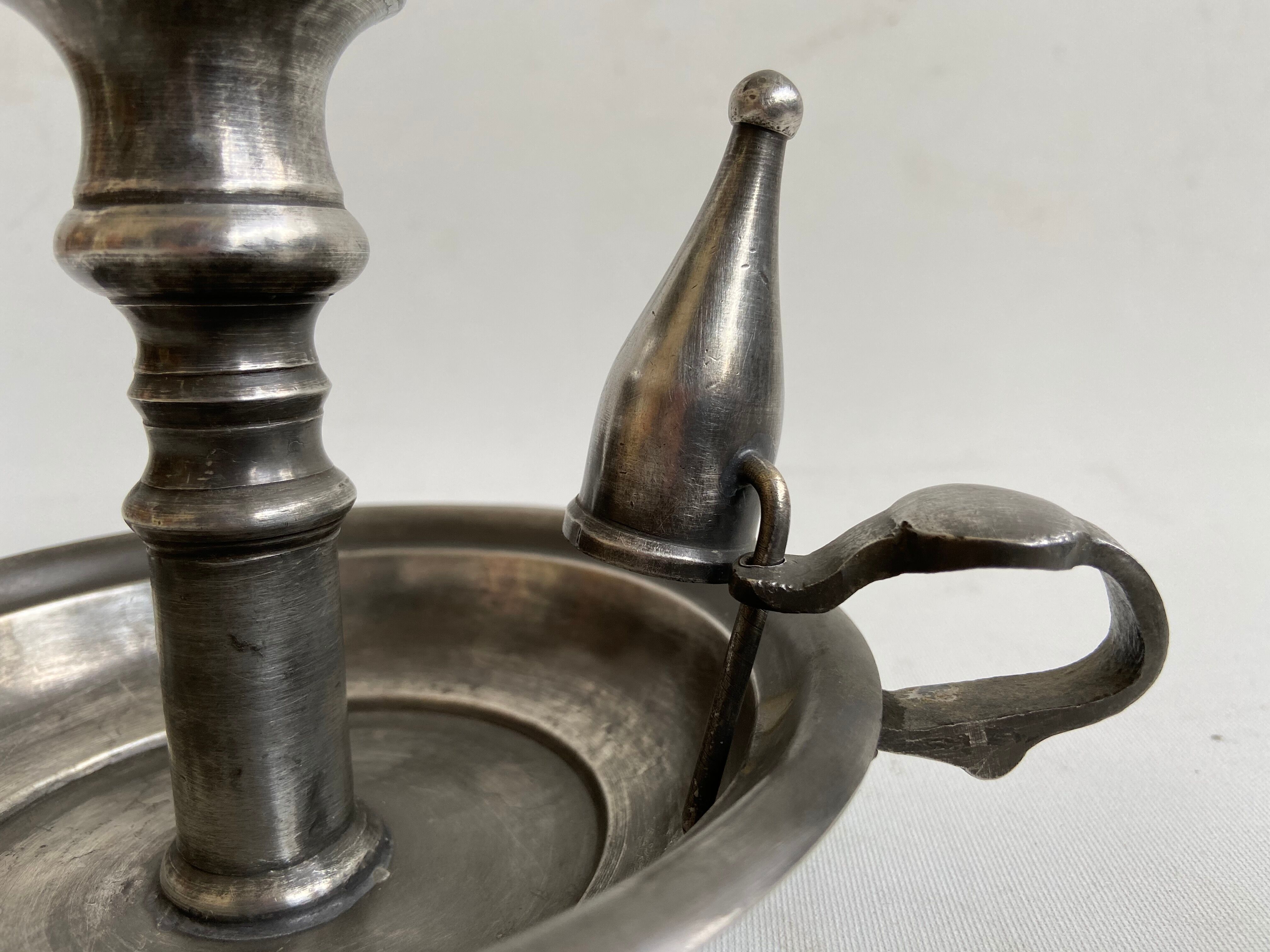 Tin candlestick with extinguisher