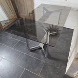 Chromed metal table with smoked glass top