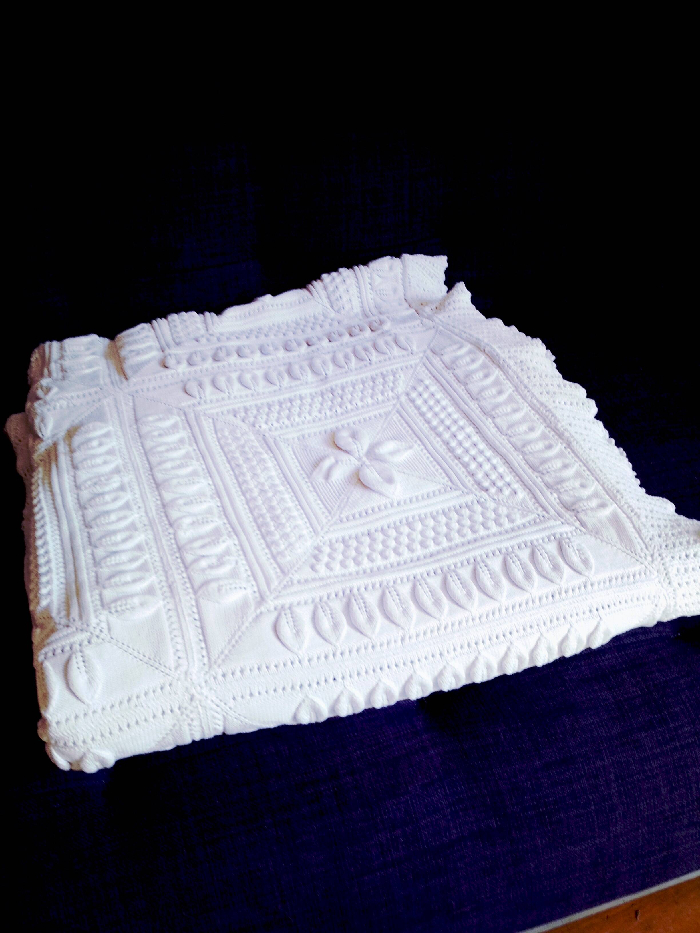 Knitted white cotton bedspread