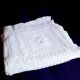 Knitted white cotton bedspread