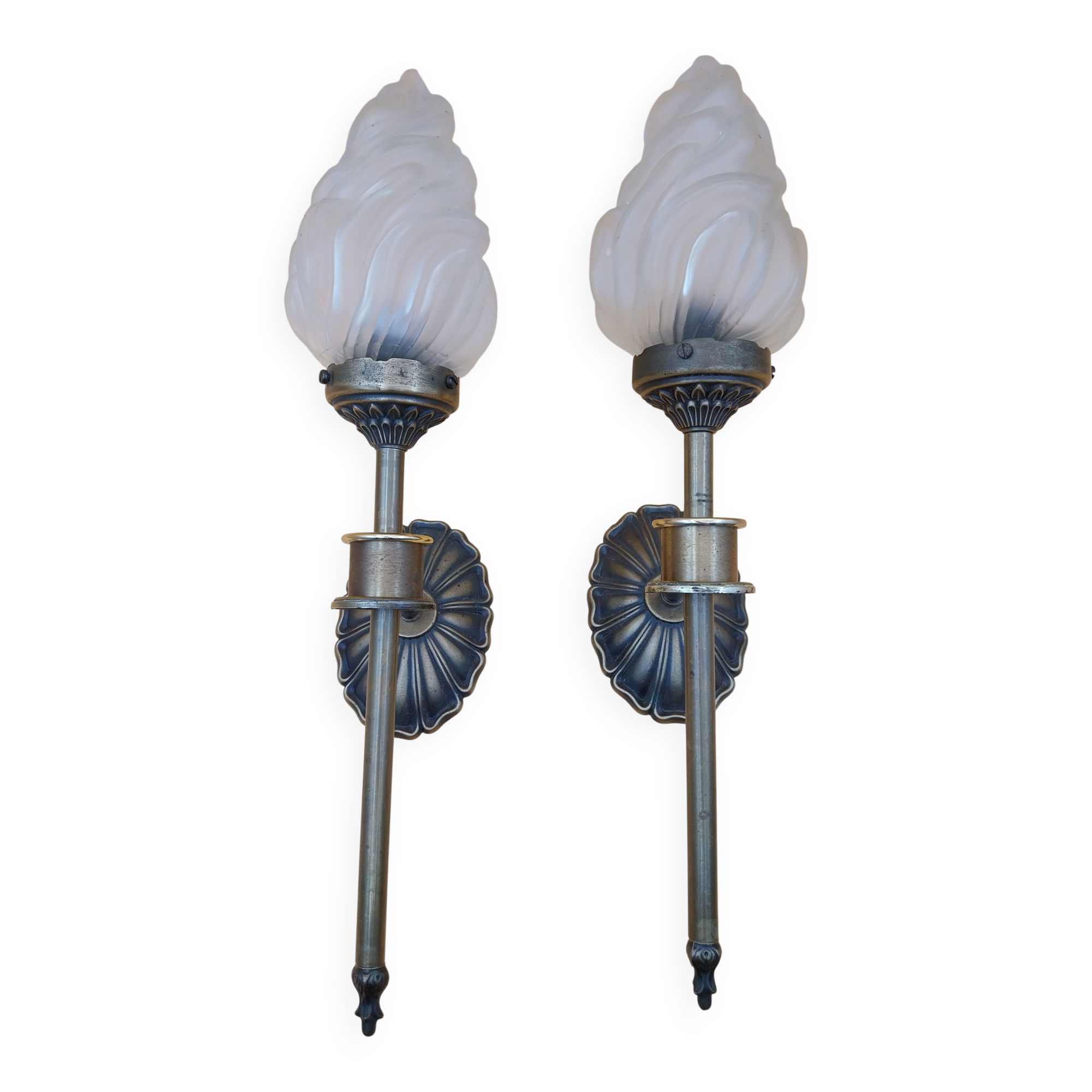 Pair of brass torch wall lights with globe flame.