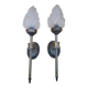 Pair of brass torch wall lights with globe flame.
