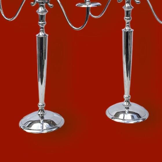 Pair of vintage three-armed chrome metal candlesticks